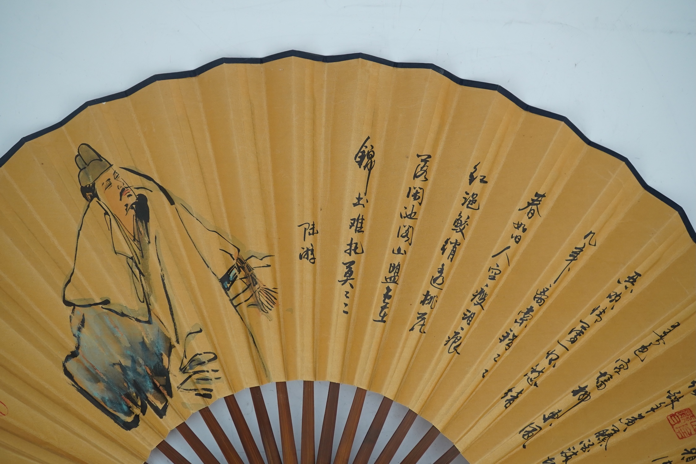 A fine Chinese sandalwood brise fan with finely carved sticks and guards, together with a mid 20th century silk calligraphic poetry LuYou fan, brise fan 38cm wide. Condition - minute damage to carving on one stick, sanda